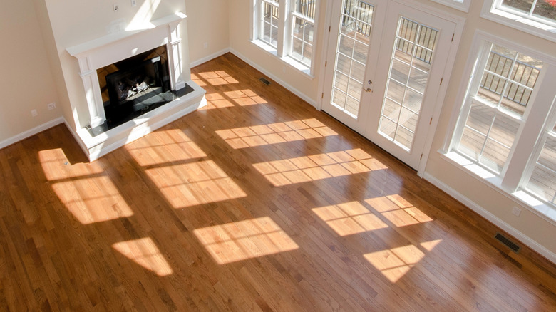 Clean hardwood floors in room with fireplace