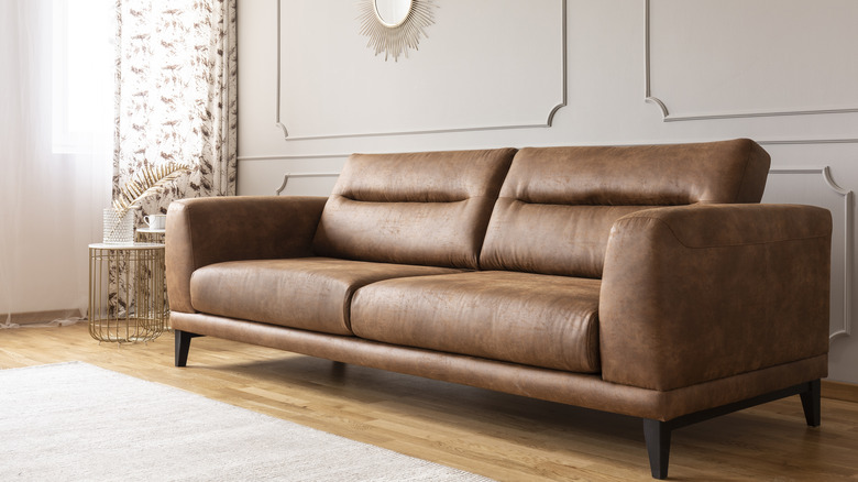 Leather couch in neutral room