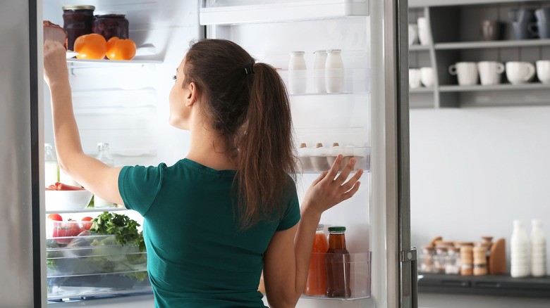 Person looking in a fridge