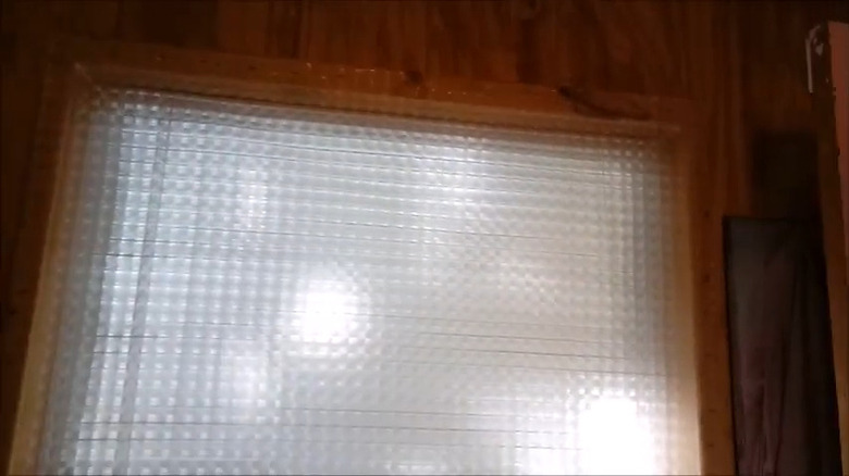 Shower curtain window shield