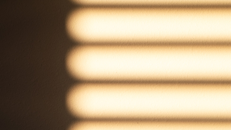 Stripes of light on wall