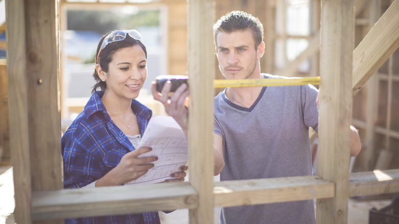 Couple building tiny house