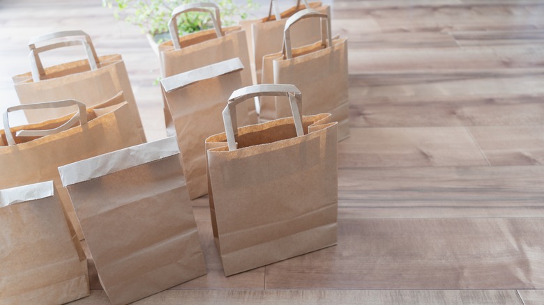 Brown paper bags on wood floor