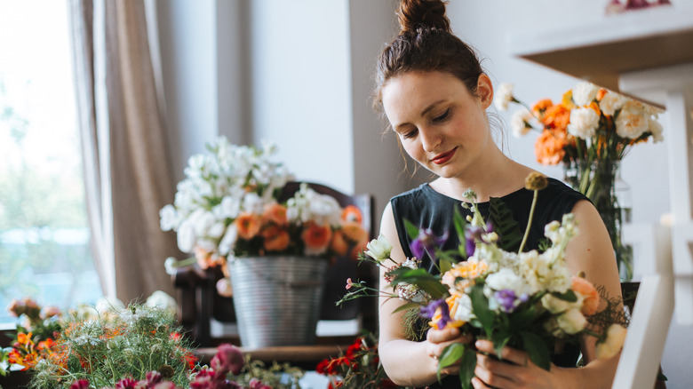 woman arranging flowers 