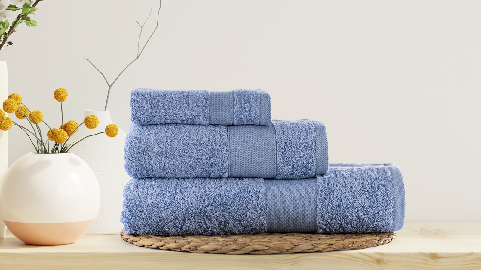 Заменить полотенца. Стирка полотенец. Полотенца на столе в ванной. Стирка полотенца Shutterstock. Fluffy Towel.