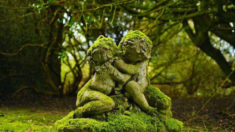 moss-covered garden statue