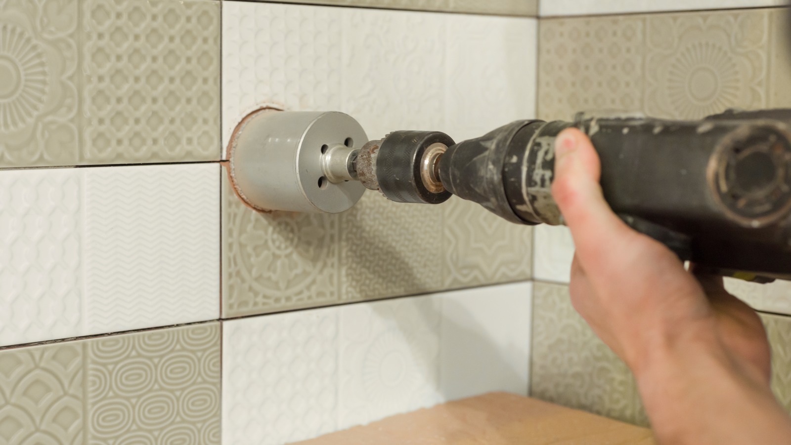 https://www.housedigest.com/img/gallery/this-tiktokers-hack-for-drilling-tile-is-so-genius/l-intro-1692809508.jpg