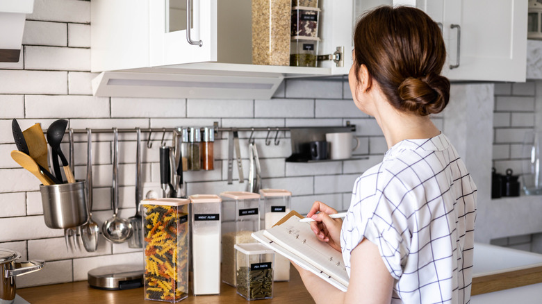 Person organizing kitchen