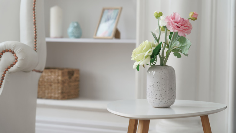 white vase with roses