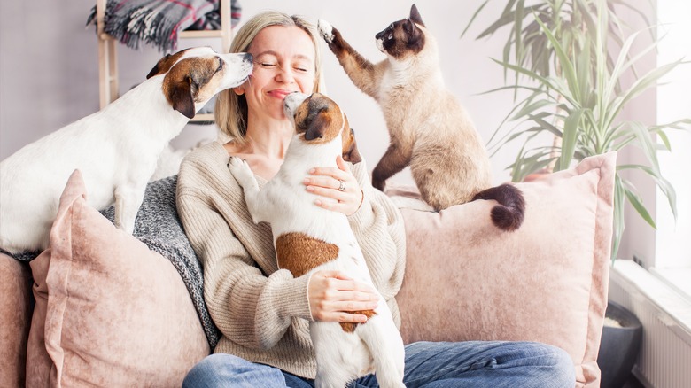 Woman sitting with pets