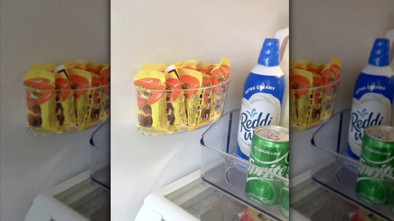 person organizing refrigerator 