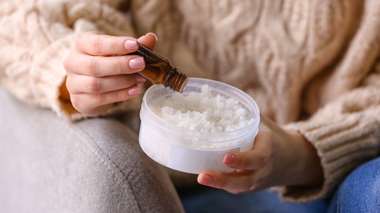 Dropping essential oil onto salt