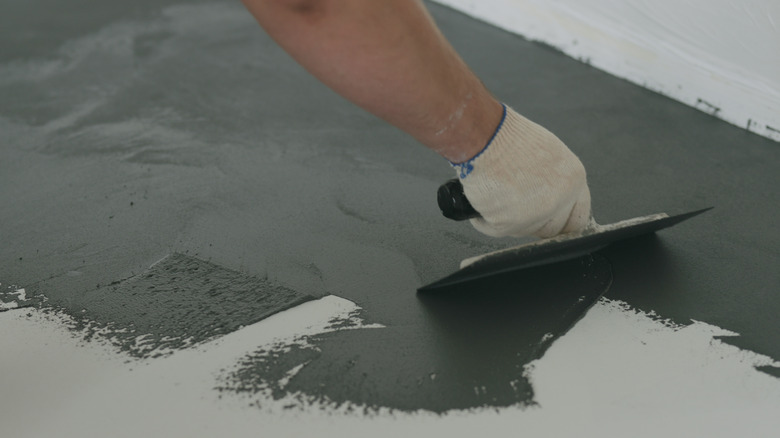 Person swiping micro cement