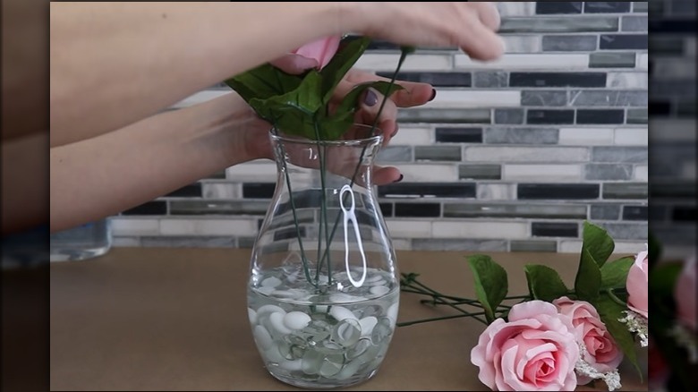 faux flowers in glue vase