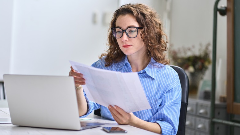 Woman looking at paper