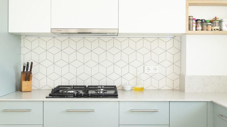 Kitchen with geometric tile backsplash 