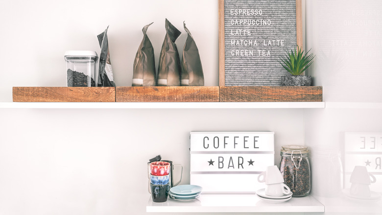 coffee bar with signs and shelves