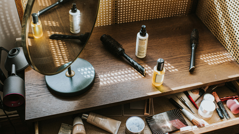 A makeup vanity with a mirror