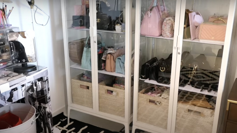 Purses in glass display cabinet from IKEA