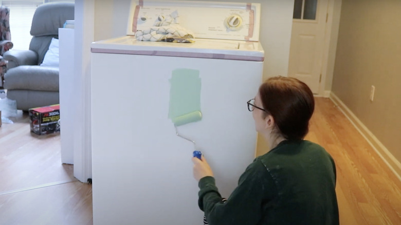 girl painting her washing machine