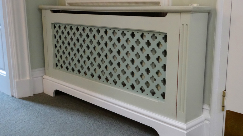 Home radiator in decorative cover