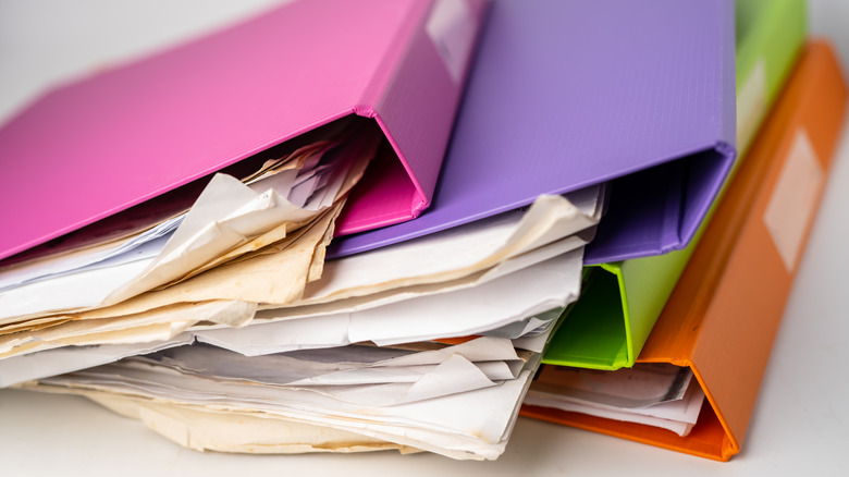 Stack of four multicolor binders