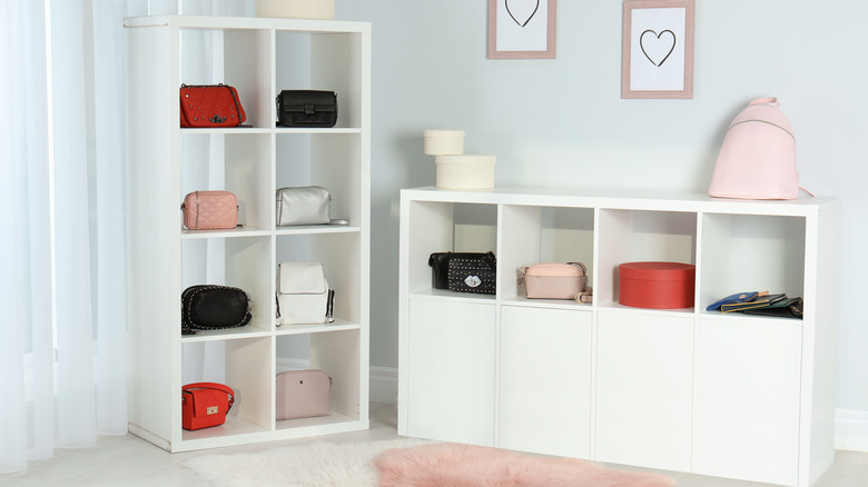 handbags displayed on shelves