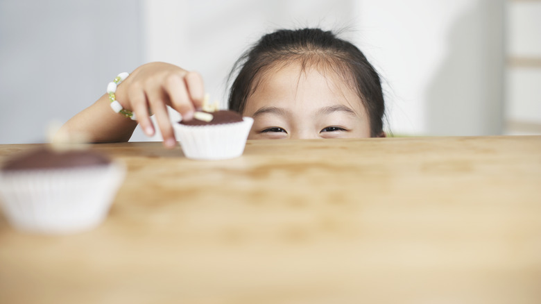 Child reaching for food