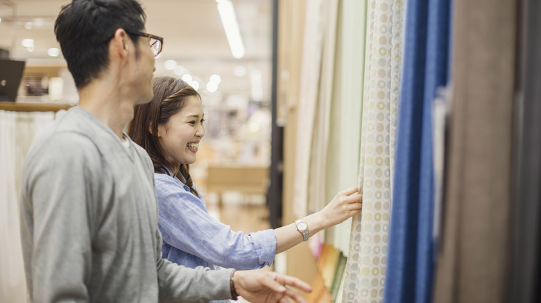 couple shopping for curtains