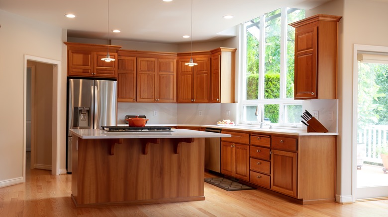 Oak cabinets with white backsplash