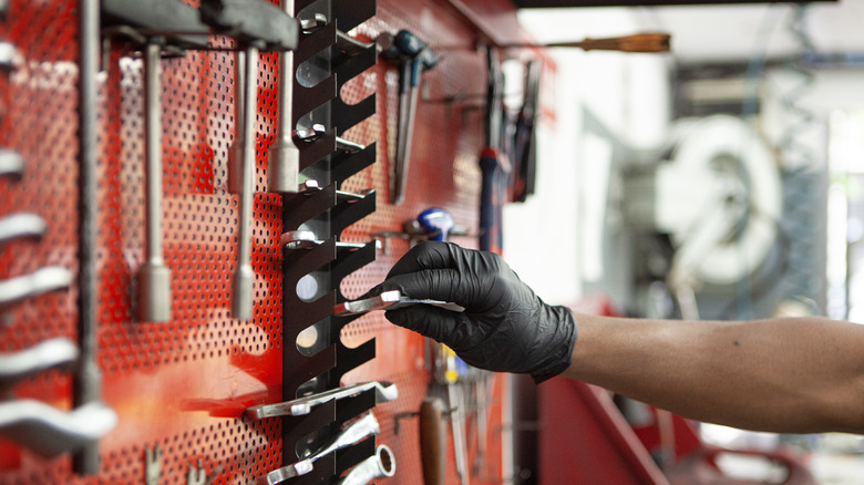 Vertical wrench holder on pegboard