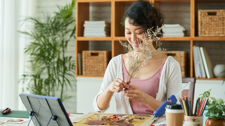 Woman making floral art