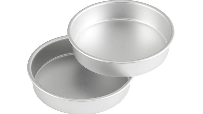 two metallic cake pans