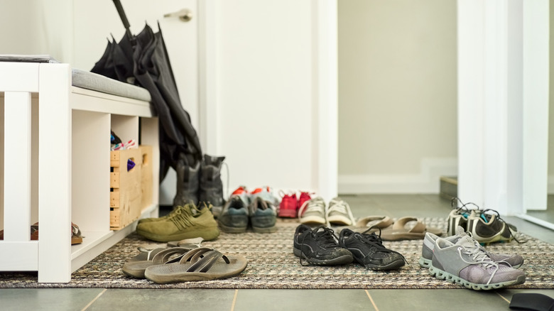 several pairs of shoes on the floor