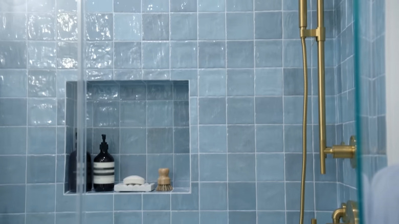 A light blue ceramic tile in shower designed by The Property Brothers