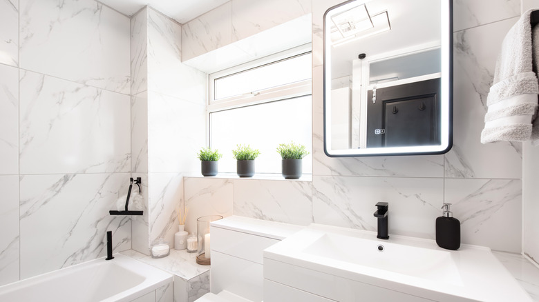 Large marble tiles in a bright bathroom