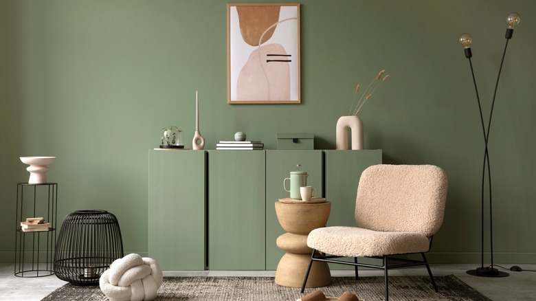 mossy green room with modern wall art