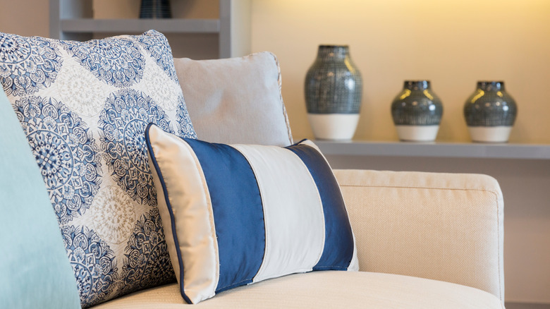 close up of blue and white throw pillows