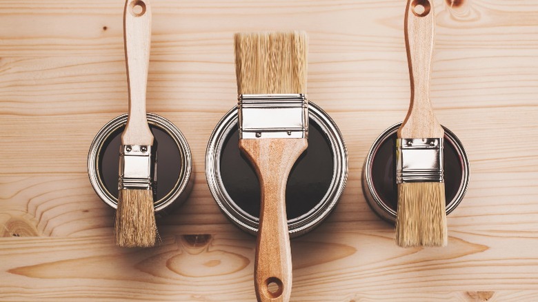 Brown paint and paint brushes