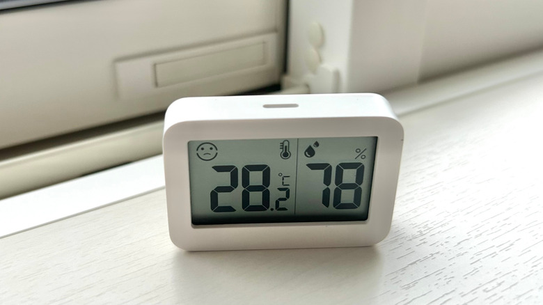 Digital temperature and humidity monitor reading 78% humidity