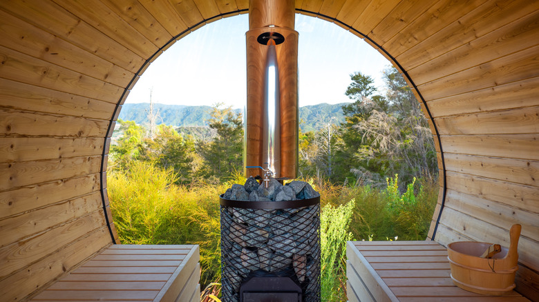 A view of of the wilderness from inside a barrel sauna