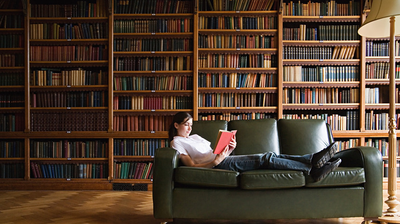 Woman reading on settee