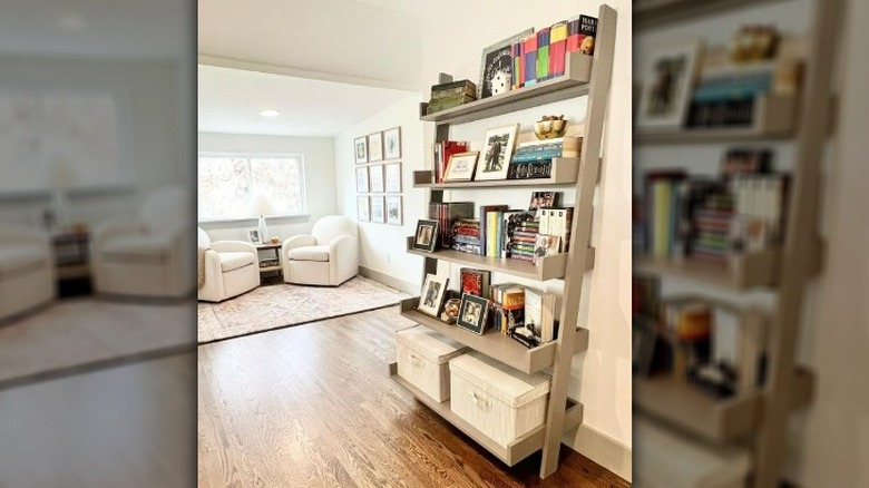 Leaning ladder bookshelf filled with books