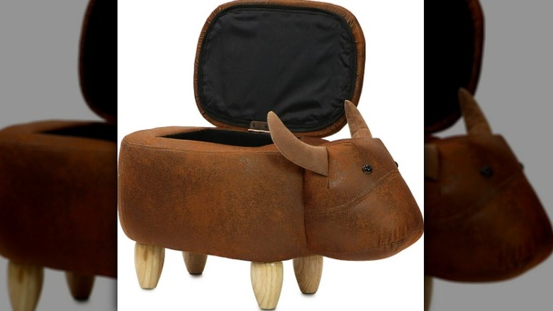 Footstool storage shaped like a cow