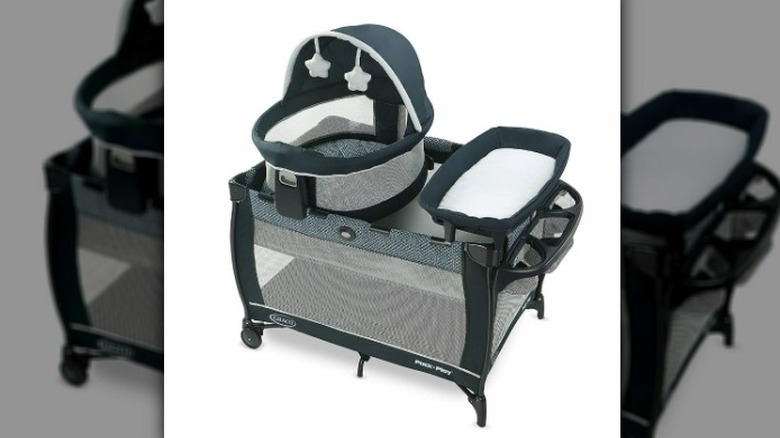 Combination bassinet, changing table, and crib