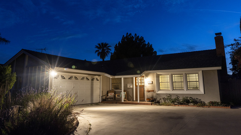 Home with well-lit driveway