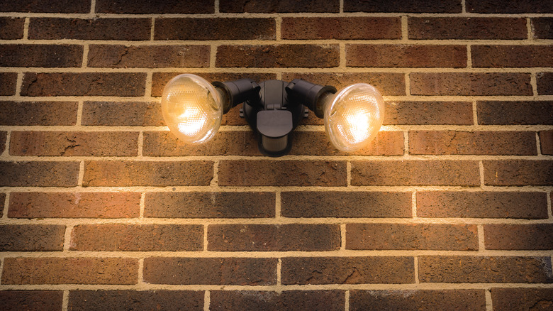 Floodlights on brick wall