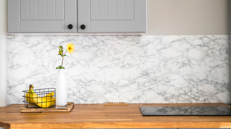 Kitchen counter with marble wallpaper