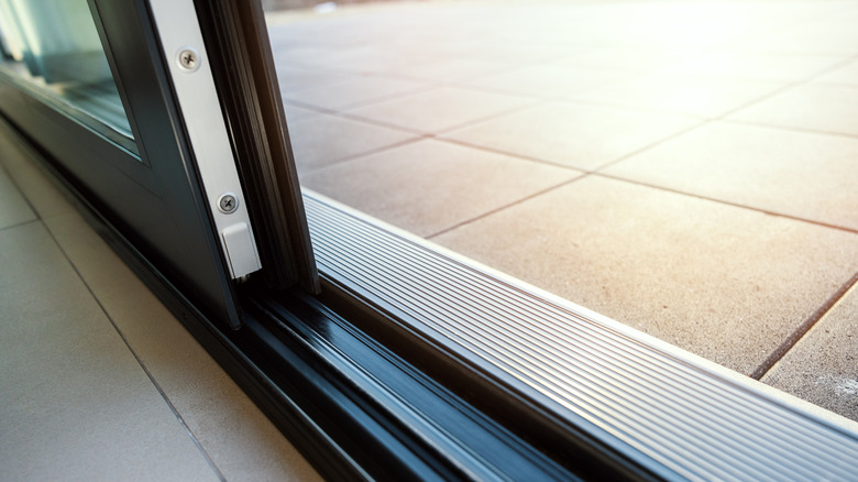 A close up view of a sliding glass door track