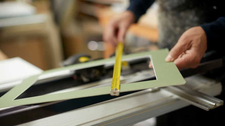 person measuring mat